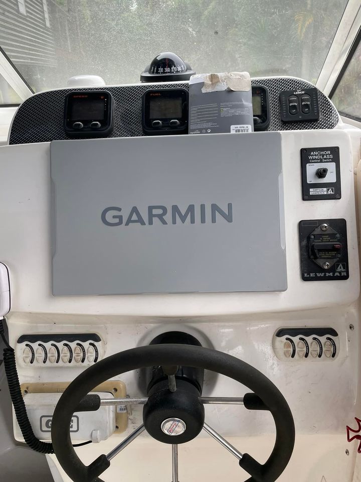 Boat With Garmin Logo— Sunshine Coast Marine Electrical Doctor In Coolum Beach, QLD